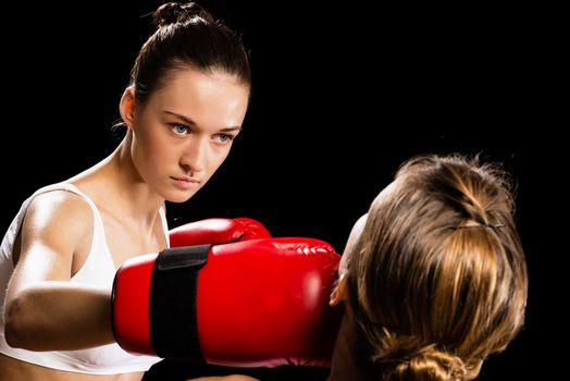 Aggressive boxing woman, hits an opponent in the head