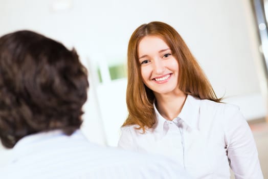 Attractive woman talking with a man, close up portrait