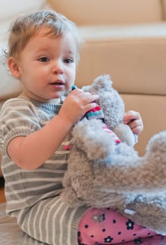 Little girl with her teddy bear