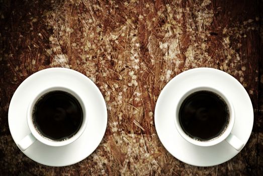 Coffee cup on grunge wood table, Retro concept