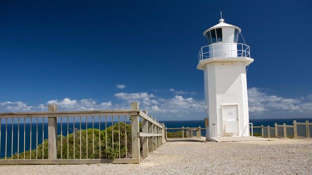 White lighthouse over looking the sea