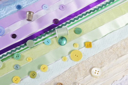 Sewing with ribbons, buttons and thumble 