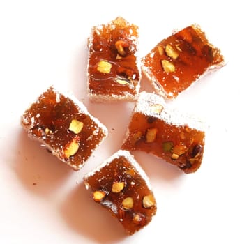 Sweet turkish delights with nuts on white background 