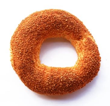The Turkish bagel strewed by sesame seeds on white background