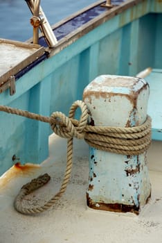 Fishing boat tied by a rope