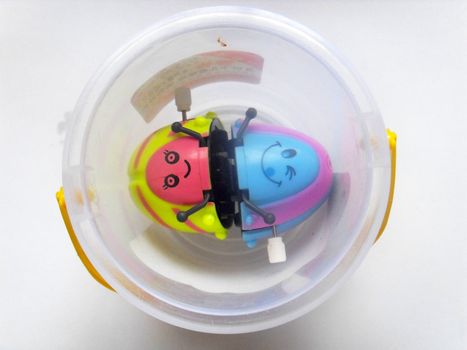 small toys in cup