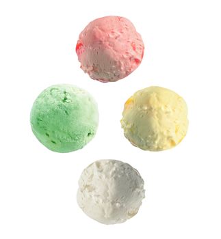 Four isolated scoops of ice cream from side