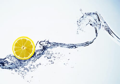 lemon in spray of water