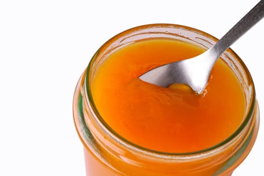Apricot jam in jar closeup with clipping path