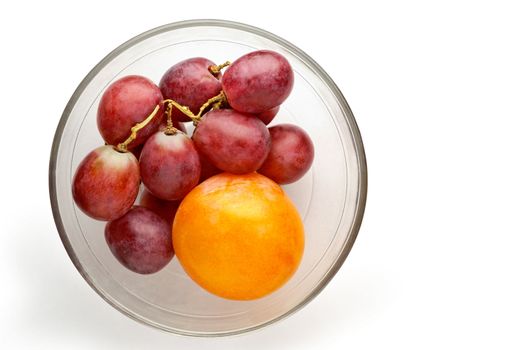 Grapes and plum in glass bowl isolated  with clipping path