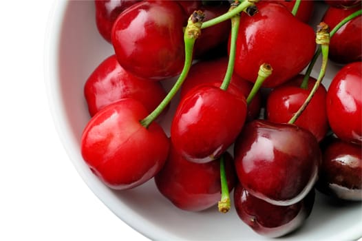 Fresh cherries with stalk in a bowl (from top) with clipping path