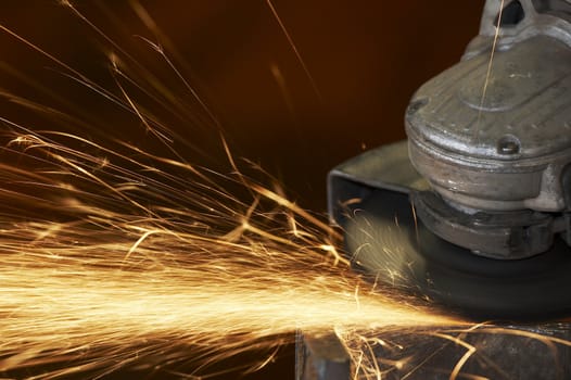 a close picture of a sparks on grinded steel