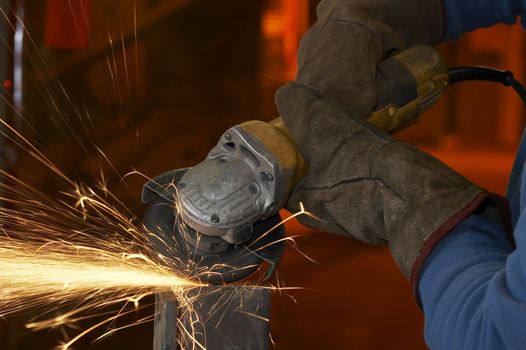 a close picture of a sparks on grinded steel