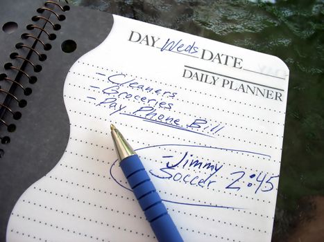 A daily planner filled with a busy parent's daily activities.