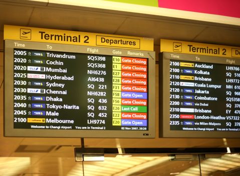 Flight announcement shows time of departure on a screen