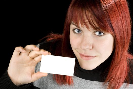 Redhead student girl holding a blank business/greeting card.