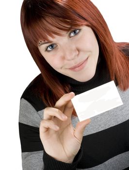 Smiling successful girl with red hair holding a blank empty business or greeting card.

Studio shot.