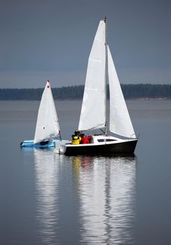 Two sailing boat at an open river. Russia