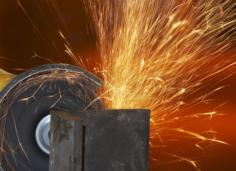 a close picture of a sparks on grinded steel