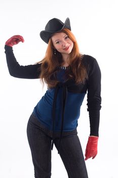 Young girl with red gloves and black hat standing on white background
