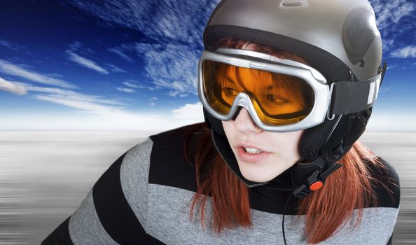 Portrait of a cute girl with red hair snowboarding on a winter background.

Studio shot, composite.