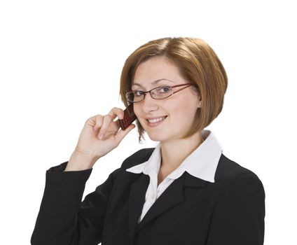 Smilling businesswoman with glasses using a mobile phone.