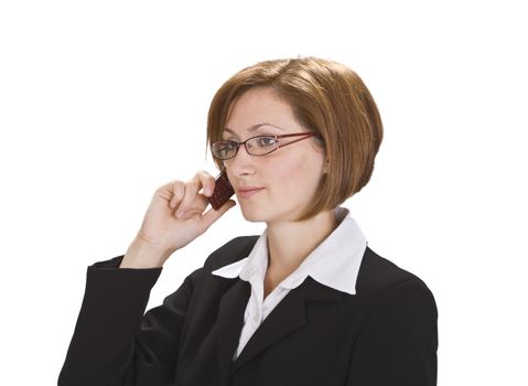 Serious businesswoman with glasses using a mobile phone.