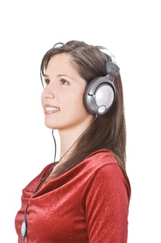 Image of a beautiful brunette with headphones listening to music.