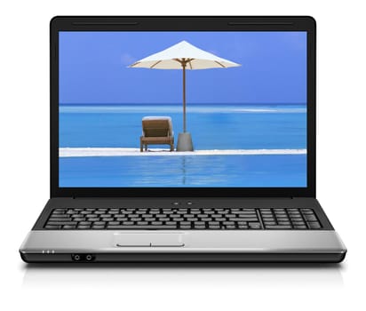 Computer notebook on beach - business travel background