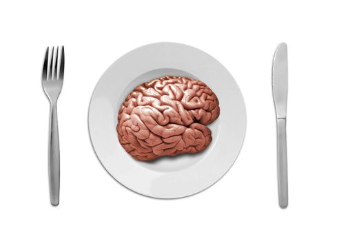 a human brain on plate with fork and knife