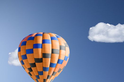 Hot air balloon against brilliant blue sky