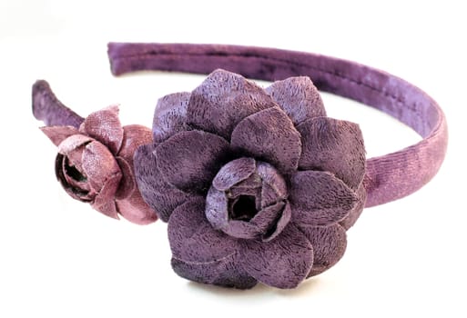 Violet velvet hair band with a pink and violet flowers handmade on white background