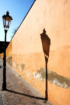 Vintage gas-lamp reflecting on the wall