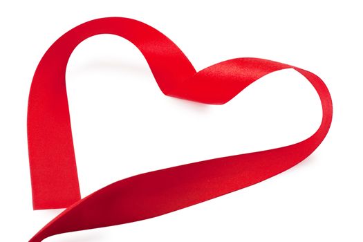 Red heart-shaped silk ribbon over white background