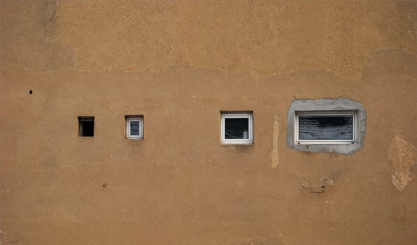 House back wall and variety of small windows