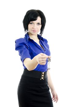 Portrait of a business woman holding keys. Isolated on white background