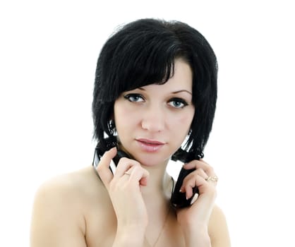 Close-up portrait of brunette woman with headphones, isolated over white background
