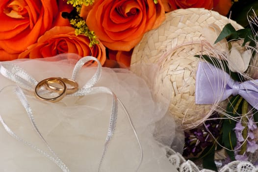 weeding Favors, wedding rings and orange roses