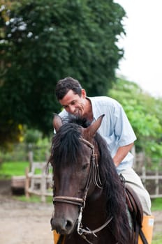 Horses and riders on a farm in Ecuador