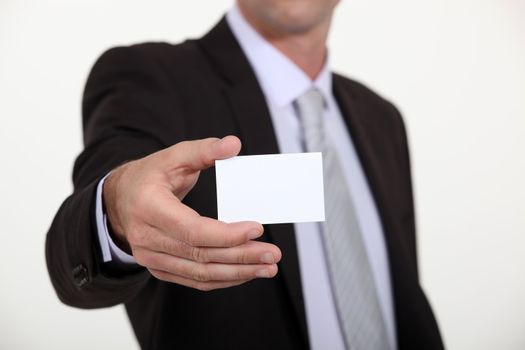 Man holding a blank business card