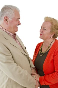 Older male and female looking at eachother happily and trustfully.