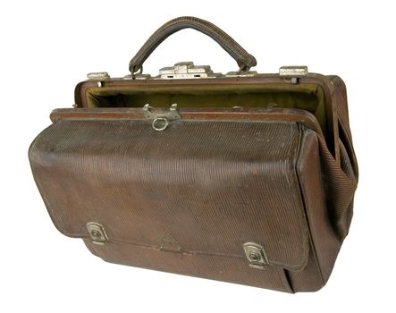 Old brown suitcase on a light background