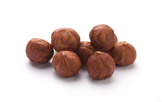 Isolated handful of brown clean cores of hazelnut