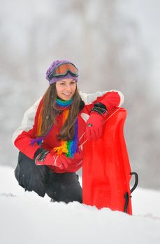 Young Beautiful Woman play in winter time