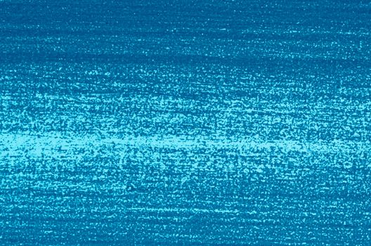 Close-up of part of  woodboard texture painted on blue.