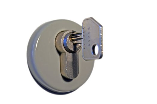 A key in a keyhole. All isolated on white background.