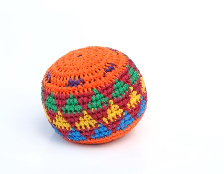 A typical hackysack isolated on a plain white background.