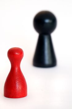 A small red figure against a huge black one. All on light background.