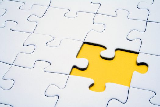 A typical jigsaw puzzle with a single yellow gap.