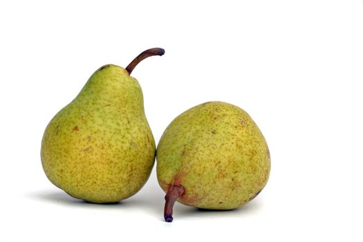 Two mellow pears lying on a plain white background.